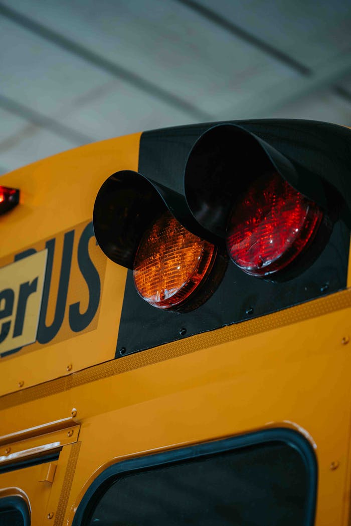 Detailed view of a school bus with focus on lights and signalization.